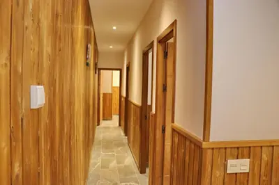 a hallway with wood paneling and a hallway with doors at Chalet Brenes Sol in Conil de la Frontera