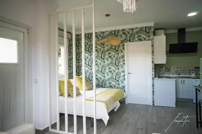 a bedroom with a bed and a wall mural at R&B Puerto Sherry Beach in El Puerto de Santa María