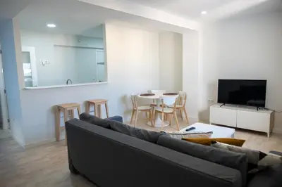 a living room with a couch and a table at El mirador de Ancha in Cádiz