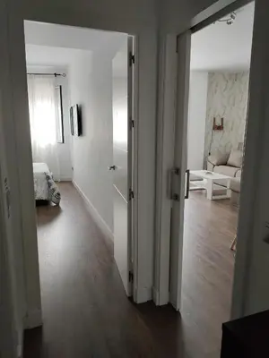 an open door to a room with a living room at Apartamento La Paraíta in Chiclana de la Frontera