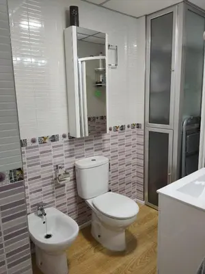 a bathroom with a toilet and a sink at Apartamento La Paraíta in Chiclana de la Frontera