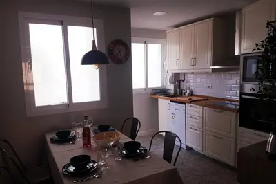 a kitchen with a table with chairs and a table sidx sidx sidx sidx at La Isla Centro II in San Fernando