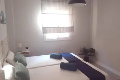 a living room with a couch and a window at La Isla Centro II in San Fernando