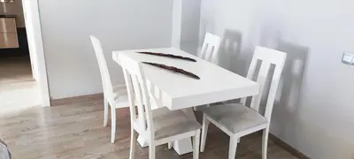 a white dining room table with four chairs at Piso 100 metros del Centro del Pueblo 6 kilómetros de la PLAYA La BARROSa in Chiclana de la Frontera