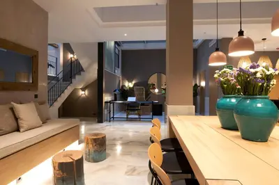 a group of tables and chairs in a room at Goodnight Cádiz Apartments in Cádiz