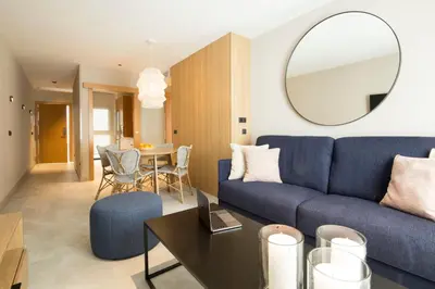 a living room with a couch and a table at Goodnight Cádiz Apartments in Cádiz