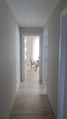 an empty hallway with a chair in a room at Cádiz desde el balcón in Cádiz