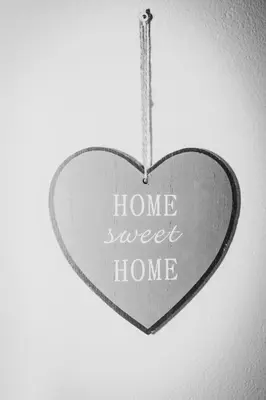 a heart shaped sign with the words home sweet home at Villa ANDROMEDA in Chiclana de la Frontera