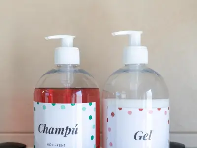 two bottles of laundry detergent sitting next to each other at Apartamento LABORT Apartamento Boutique in Cádiz