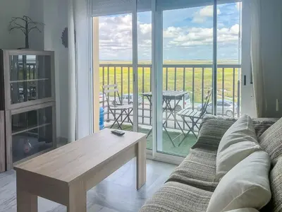 a living room with a couch and a table at GuestReady - San Fernando Ronda Estero III in San Fernando