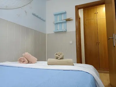 a bed with two towels on top of it at Apartamentos Coralba - El Escondite de la Bahía in San Fernando