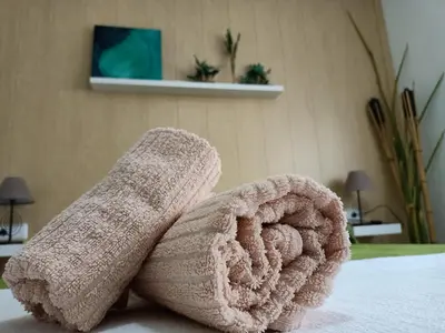 a pair of socks sitting on top of a bed at Apartamentos Coralba - El Escondite de la Bahía in San Fernando