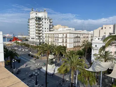 a view of a city with palm trees and buildings at Atico-Solarium CITY Hall by Cadiz4Rentals in Cádiz