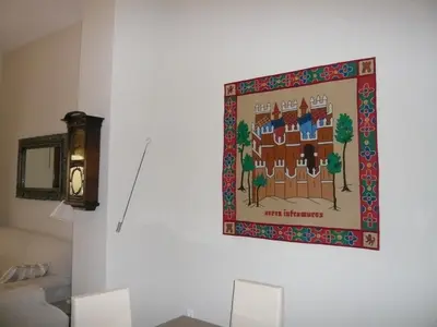 a tapestry hanging on a wall in a living room at Casa Singular , parking gratis in Jerez de la Frontera