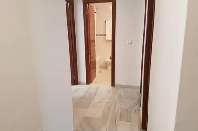 an empty hallway with a toilet in a room at Central Apartment in Sanlucar in Sanlúcar de Barrameda