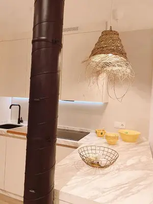 a kitchen with a table with a basket on it at SibsSanlucar MARITIMO-1ª Linea de Playa in Sanlúcar de Barrameda