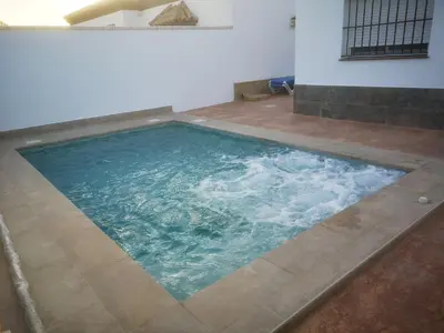 a large pool of water in a room at Casita Rural CONIL in Conil de la Frontera