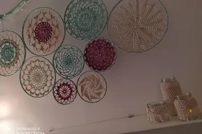 a bunch of plates hanging on a wall at Apartamento en primera línea de playa in Sanlúcar de Barrameda