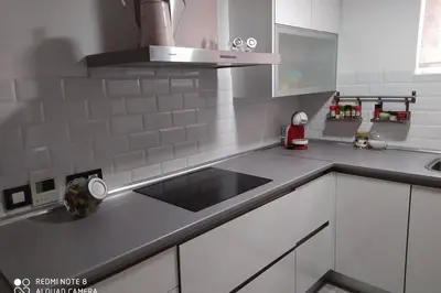 a kitchen with a sink and a counter top at Apartamento en primera línea de playa in Sanlúcar de Barrameda