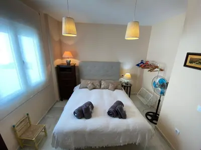a bedroom with a bed with two teddy bears on it at MAGNÍFICO ÁTICO PLENO CENTRO. Terraza 60m. Climatizado, Garaje in Sanlúcar de Barrameda
