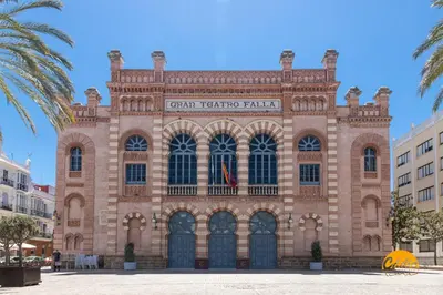 a large brick building with a sign on it at Green Home by Cadiz Time in Cádiz