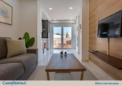 a living room with a couch and a coffee table at Apartamentos La BRUJULA by CadizRentals in Cádiz