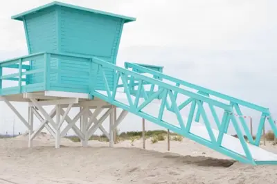 a blue life guard shack on the beach at Casa en zona tranquila y cerca de playa virgen in San Fernando