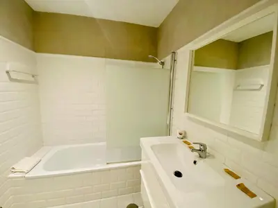 a white bathroom with a tub and a sink at La Posada de Sacramento Grupo AC Gestion in Cádiz