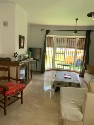 a living room with a couch and a table at Chiclana casa maría in Chiclana de la Frontera