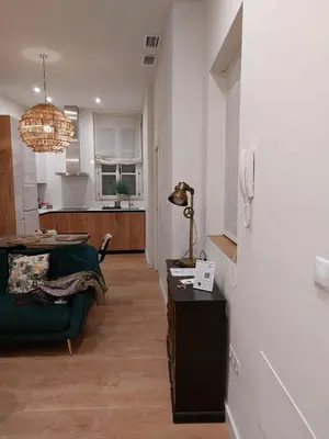 a living room with a couch and a table at Hidden Gem Pasquin Suites in Mercado Central in Cádiz
