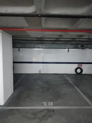 an empty parking garage with a car parked in it at Loft Victoria Beach - FREE PARKING by Cadiz Time in Cádiz