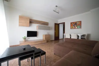 a living room with a couch and a table at Cerquita de la Caleta by Gades Gestión in Cádiz