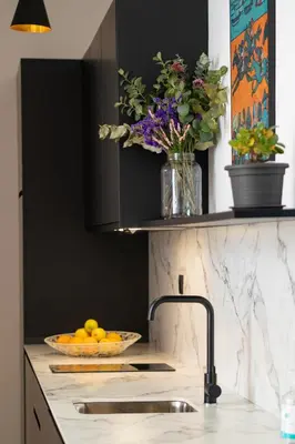 a kitchen counter with a sink and a bowl of fruit at Casa Miguel - Apartamento 1 in Sanlúcar de Barrameda