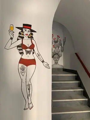 a mural of a woman holding a glass of wine at Casa Miguel - Apartamento 3 in Sanlúcar de Barrameda