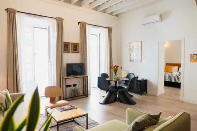 a living room with a couch and a table at Casa Miguel - Apartamento 2 in Sanlúcar de Barrameda