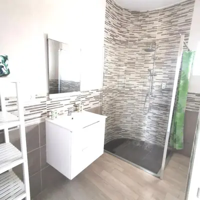a bathroom with a white sink and a shower at Brisa marina novo sancti petri in Chiclana de la Frontera