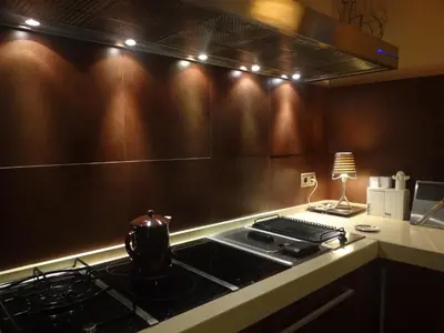 a kitchen with a stove and a counter top at habitacion en casa kenya in Jerez de la Frontera