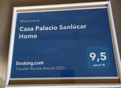 a sign for a casa palapa santander home at Casa Palacio Sanlúcar Home in Sanlúcar de Barrameda