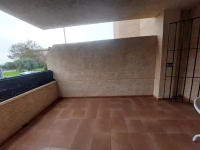a large room with a large window and a tiled floor at Piso Bajo Guía in Sanlúcar de Barrameda