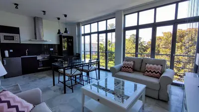 a living room with a couch and a table at APARTAMENTOS MINA4 tipo I in Cádiz