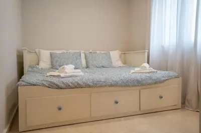 a bed with two towels on it in a bedroom at Las Palomas 15 in Sanlúcar de Barrameda