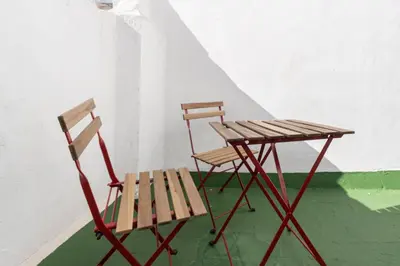 two chairs and a table and a table and chair at Apartment La Gitanilla terrace in Cádiz