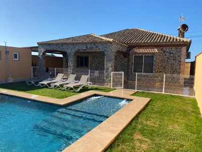 a house with a swimming pool in the yard at Casa Silvia in Cádiz