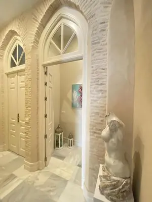a statue of a dog sitting in a hallway at innCádizPalacio Conde Casa-Brunet in Cádiz