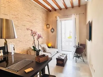 a living room with a couch and a table at innCádizPalacio Conde Casa-Brunet in Cádiz