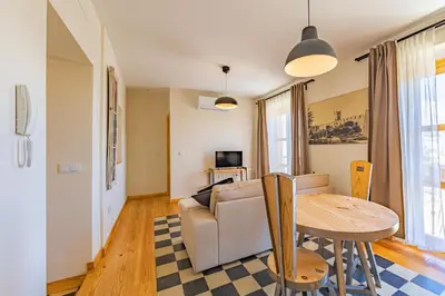 a living room with a table and a couch at New Use Pz España in Cádiz