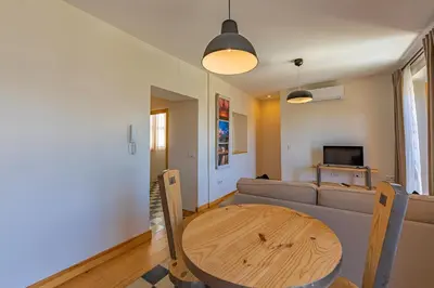 a living room with a table and a couch at New Use Pz España in Cádiz