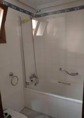 a bathroom with a shower and a bath tub at Apartamento S. Fernando bahia sur in San Fernando