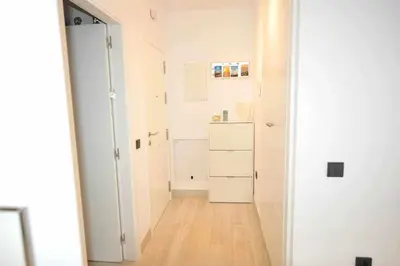an empty room with a hallway with a white closet at Acogedor apartamento en la playa de Cádiz in Cádiz
