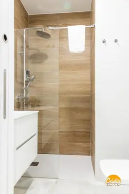 a bathroom with a shower with a glass door at Casa Patio La Viña by Cadiz Time in Cádiz